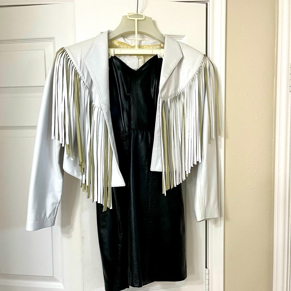 Leather unlimited black dress with white bolero jacket.